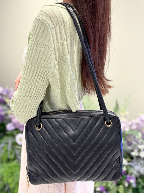 CHANEL Handbags - CHANEL CHEVRON Black Quilted CROSSBODY with Gold CC Charm